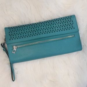 Mexx laser cut geometric wristlet clutch